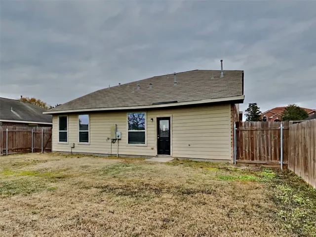 a house with wooden fence