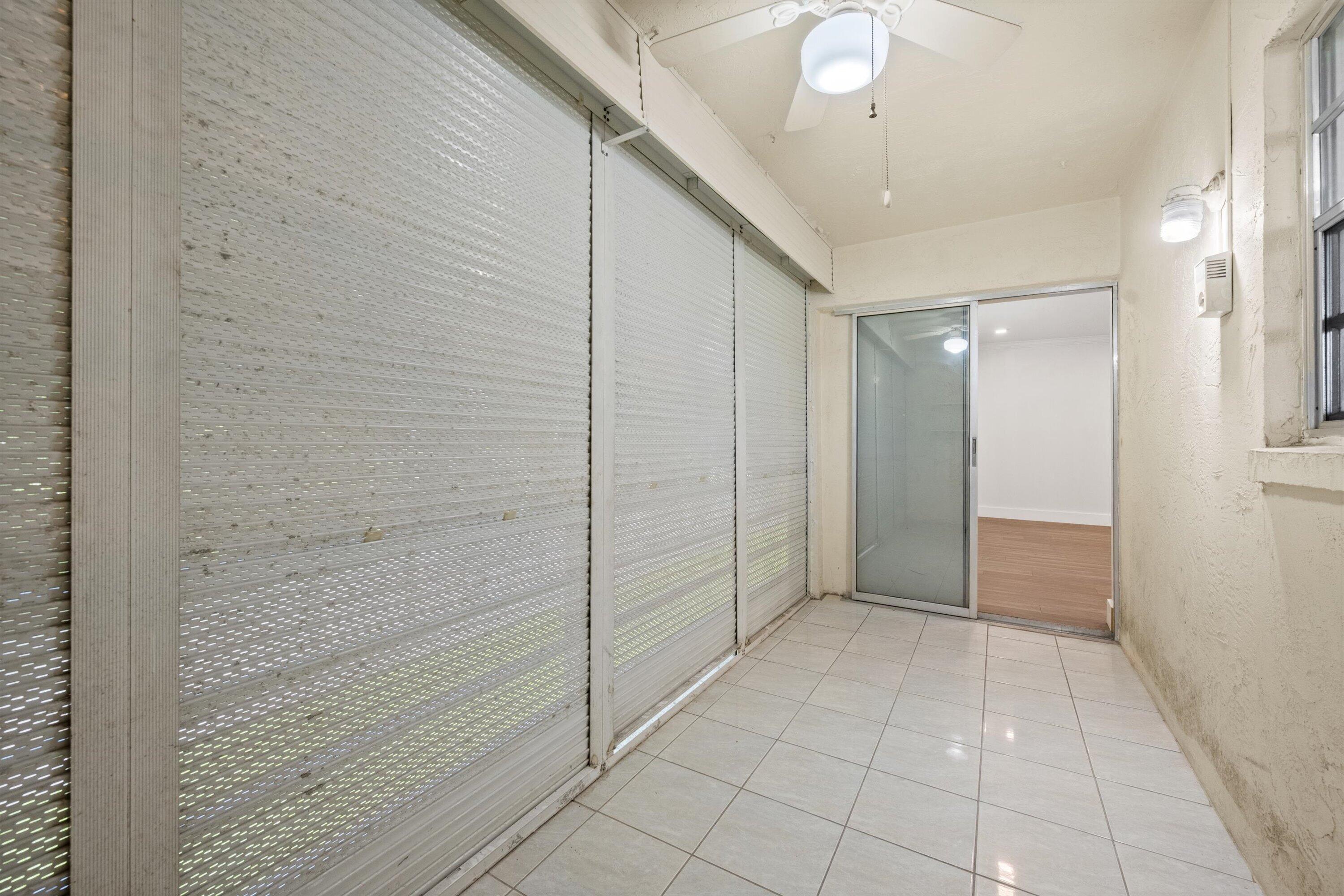 22615 Southwest 66th Avenue, Unit 208 Boca Raton, FL 33428 - Photo 26 of 29 Roll down shutters on Balcony