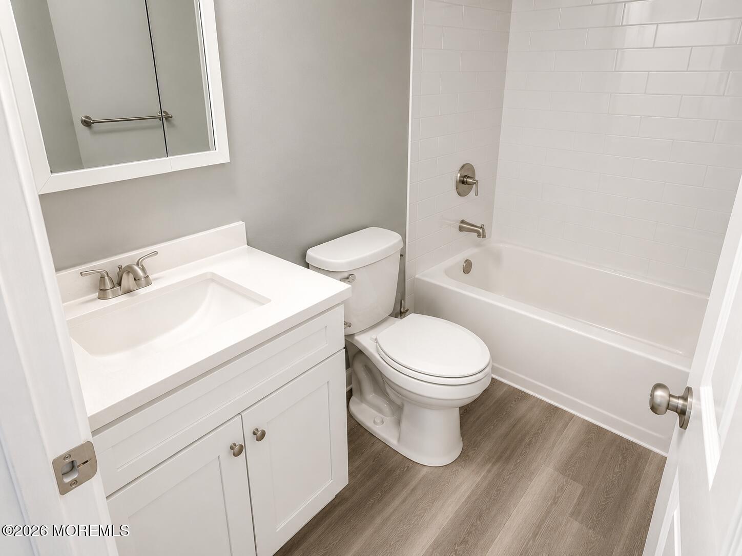 1 Max Place Howell, NJ 07731 - Photo 9 of 16 a white toilet sitting next to a bathroom sink