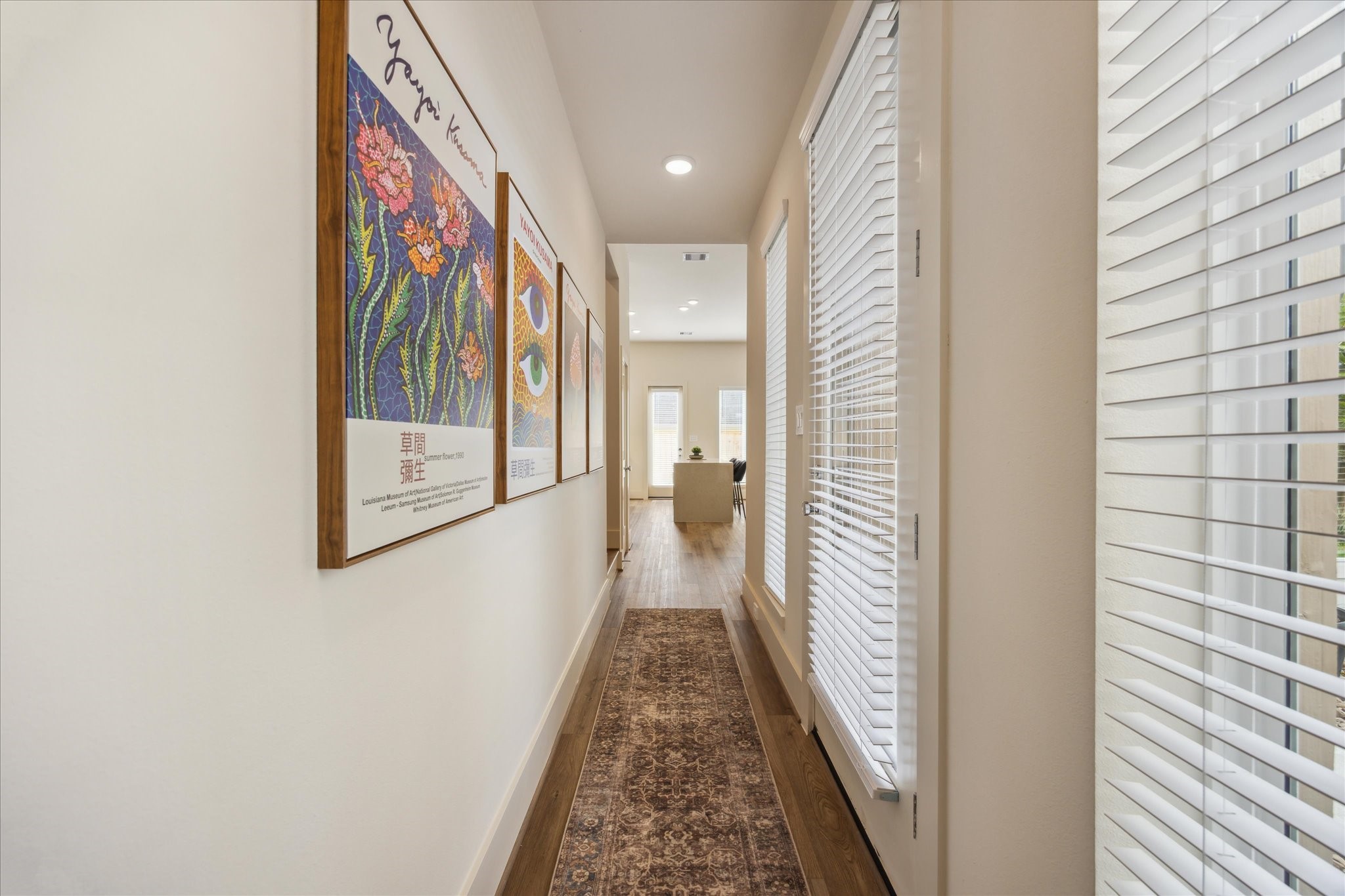 5903 Urban Pines Street Houston, TX 77091 - Photo 3 of 42 a view of a hallway with wooden floor and furniture