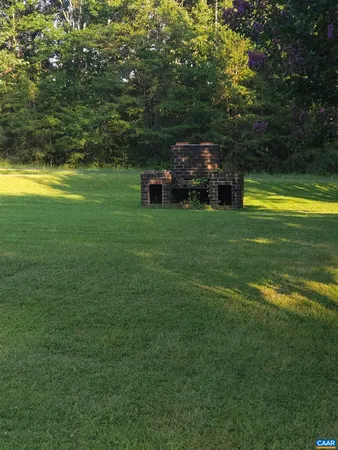 a view of a swimming pool with a yard