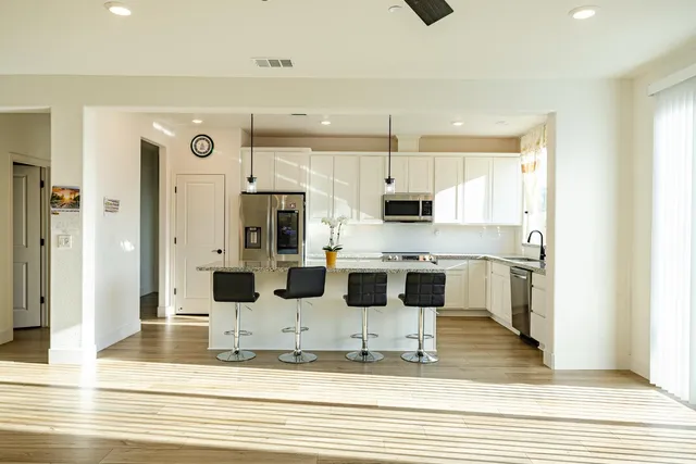 a view of a dining room with furniture window and wooden floor