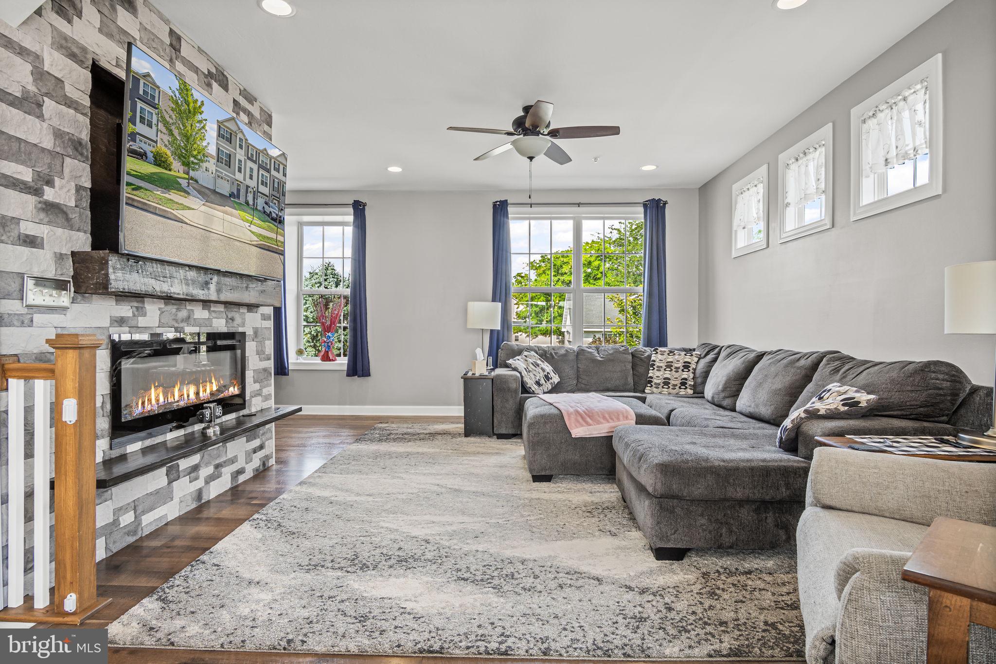34 Brookside Avenue Hanover, PA 17331 - Photo 14 of 39 a living room with fireplace furniture and a flat screen tv