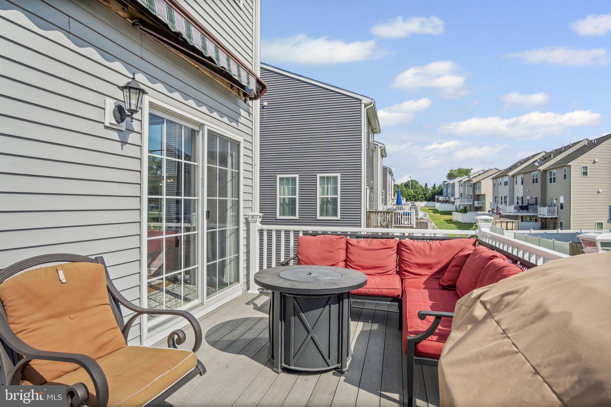 34 Brookside Avenue Hanover, PA 17331 - Photo 21 of 39 a view of a patio with couches table and chairs and a barbeque