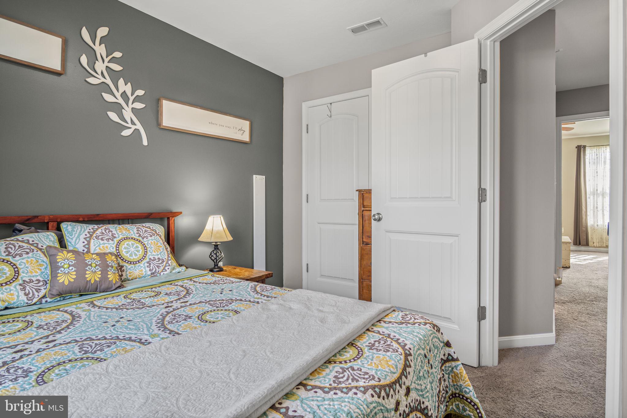 34 Brookside Avenue Hanover, PA 17331 - Photo 31 of 39 a bedroom with a large bed and chandelier
