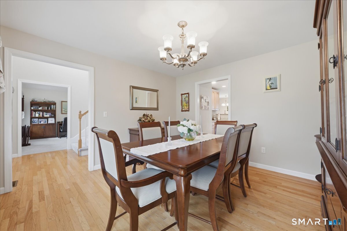 3 Lucienne Way Ledyard, CT 06339 - Photo 20 of 25 a view of a dining room with furniture and wooden floor