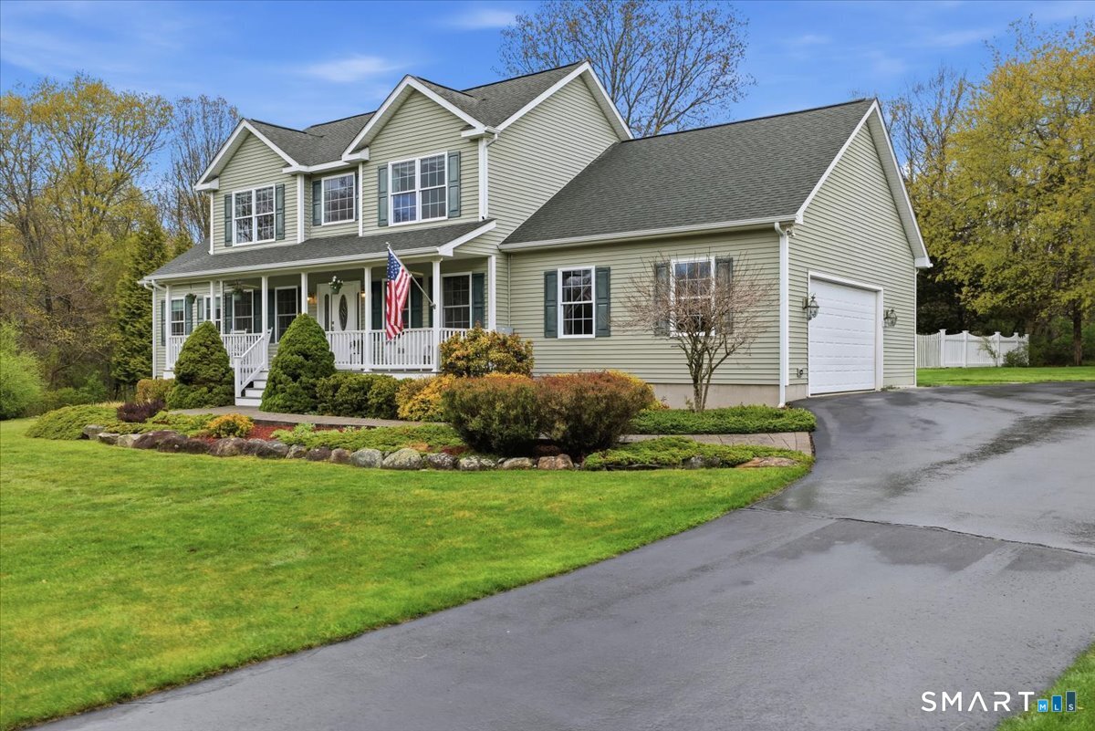 3 Lucienne Way Ledyard, CT 06339 - Photo 2 of 25 a front view of a house with a yard and garage