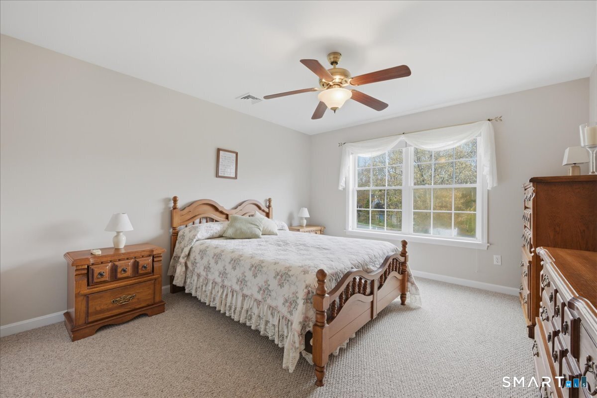 3 Lucienne Way Ledyard, CT 06339 - Photo 23 of 25 a spacious bedroom with a bed and a window