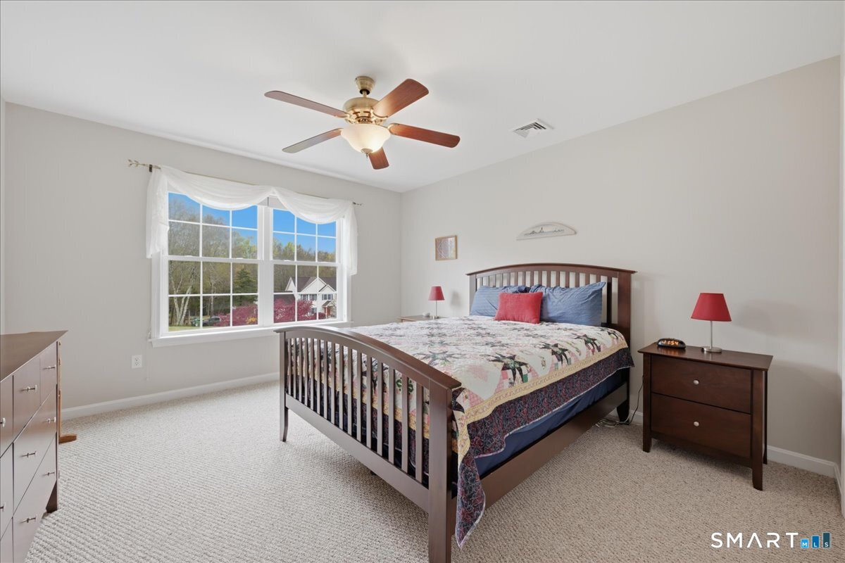 3 Lucienne Way Ledyard, CT 06339 - Photo 24 of 25 a bedroom with a bed and window