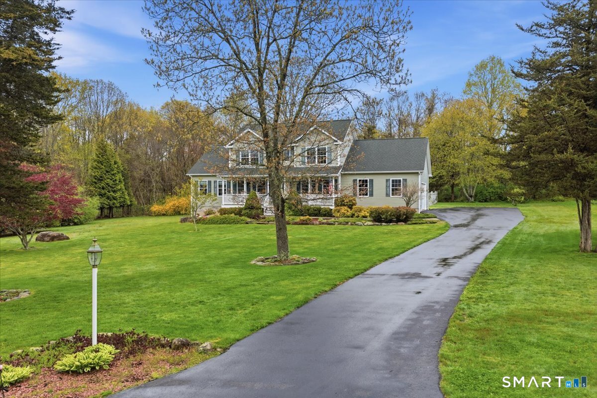 3 Lucienne Way Ledyard, CT 06339 - Photo 3 of 25 a front view of a house with a yard