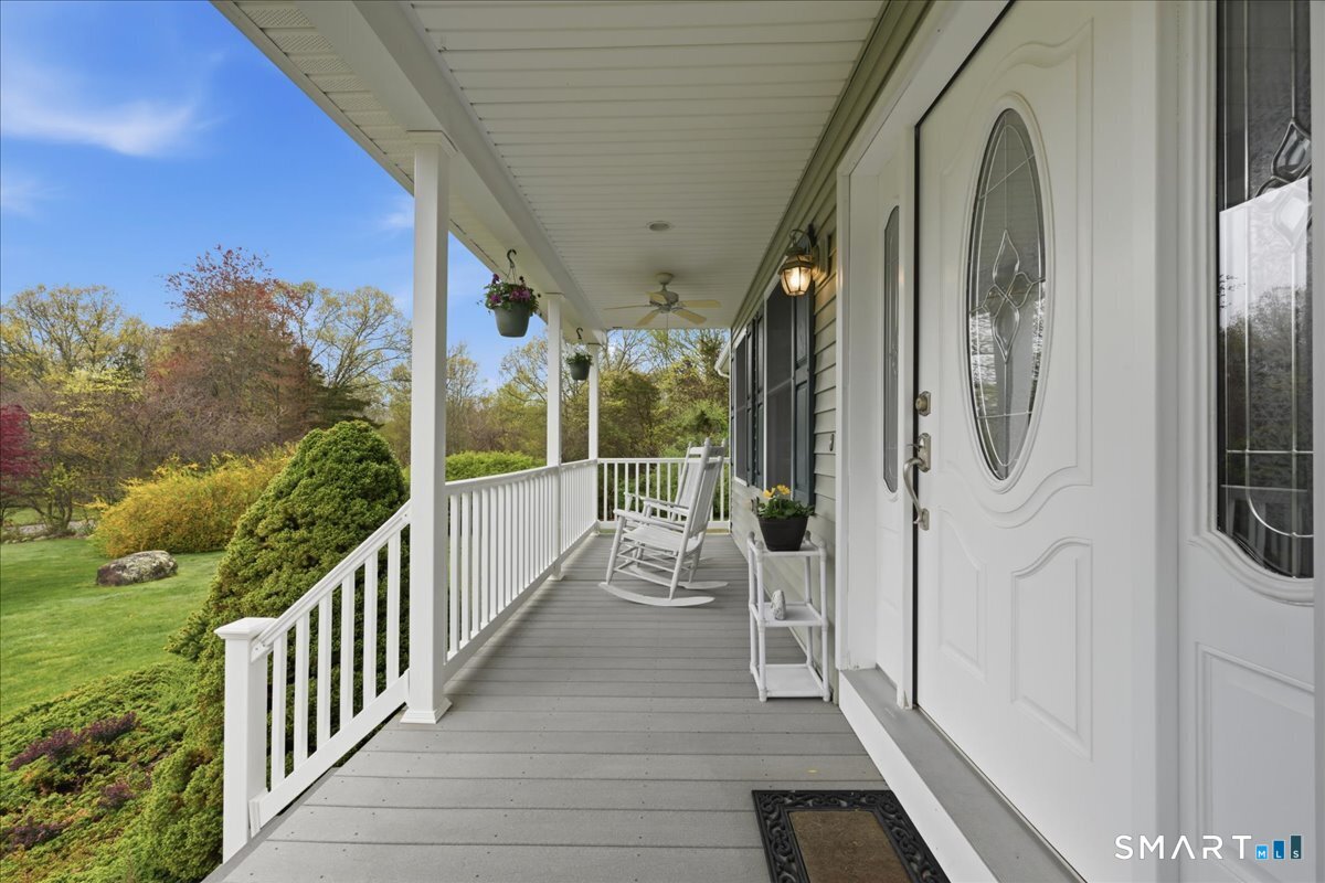 3 Lucienne Way Ledyard, CT 06339 - Photo 5 of 25 a view of a balcony with wooden floor