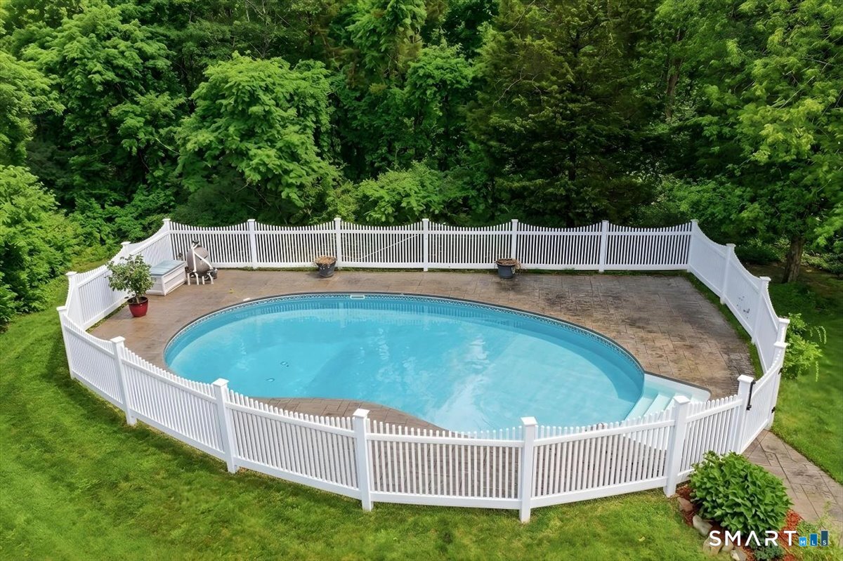 3 Lucienne Way Ledyard, CT 06339 - Photo 10 of 25 a view of a wooden deck with a small yard and large trees
