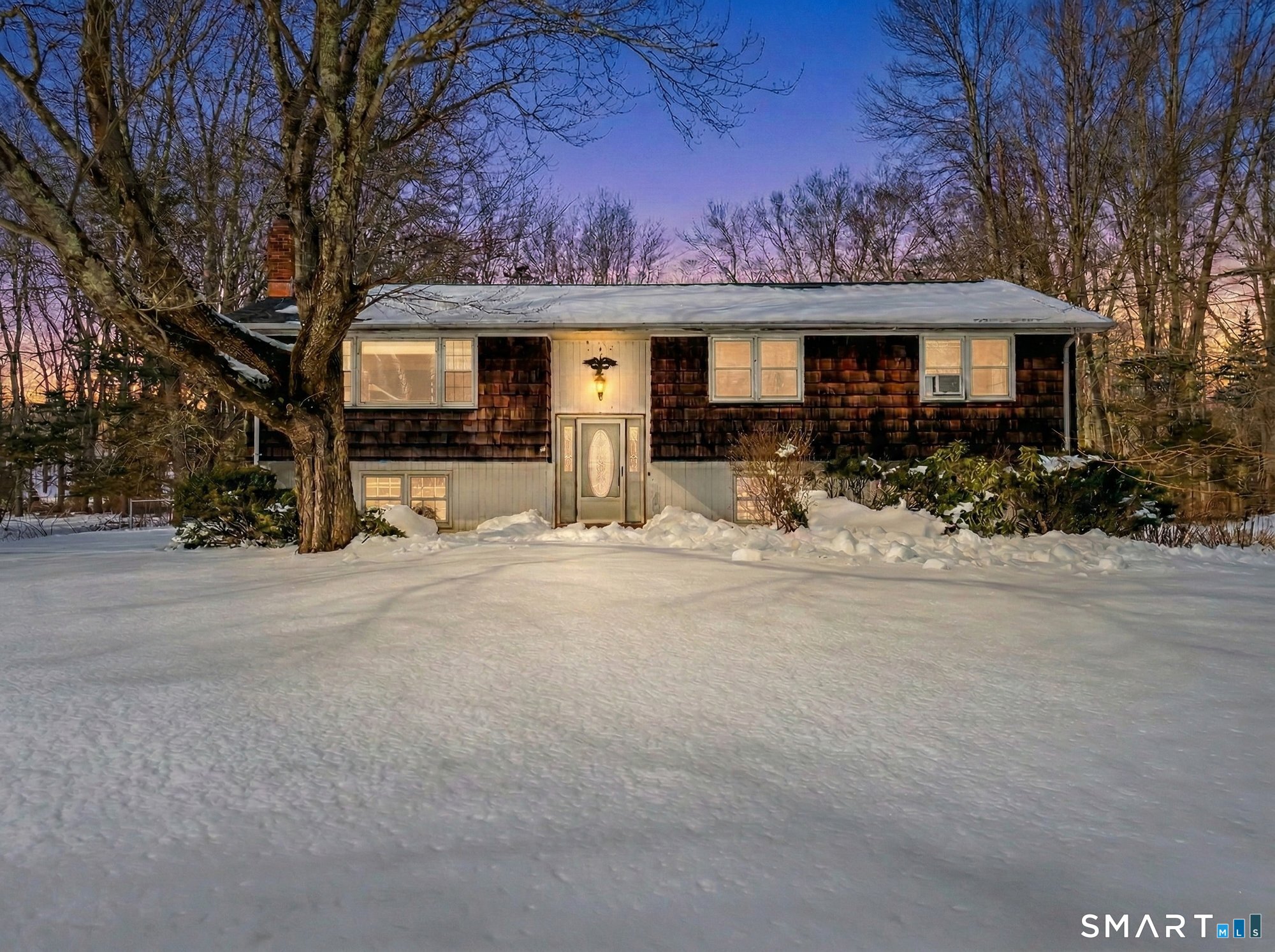 147 Tuttle Road Durham, CT 06422 - Photo 13 of 38 a front view of a house with basket ball court and a fire pit