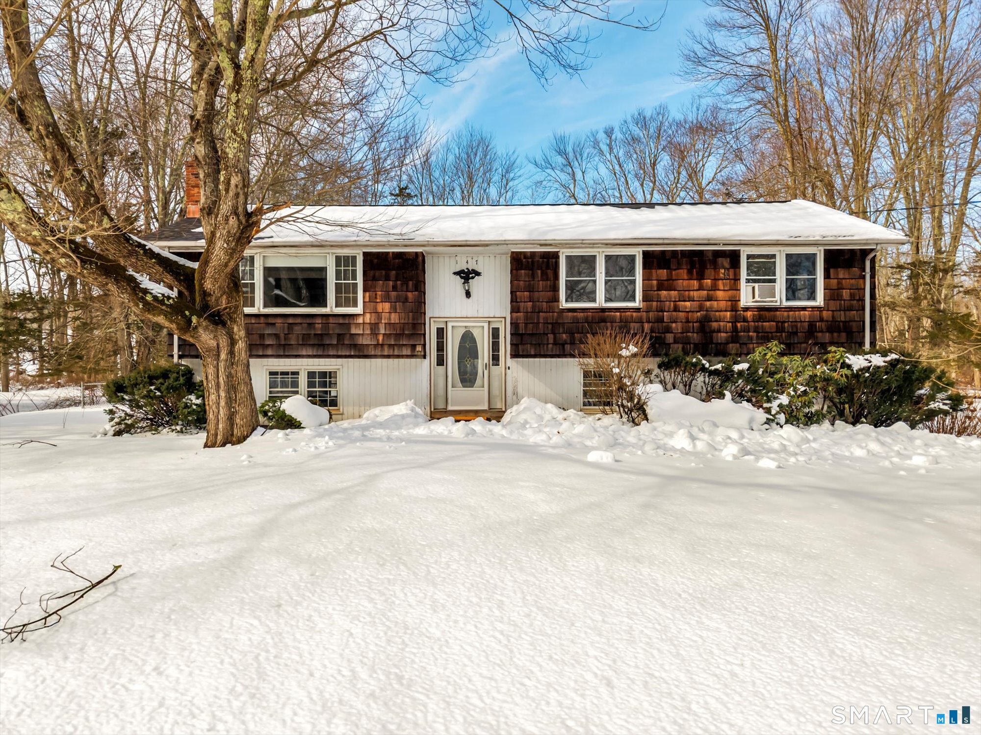 147 Tuttle Road Durham, CT 06422 - Photo 2 of 38 a view of a house with a patio covered in snow