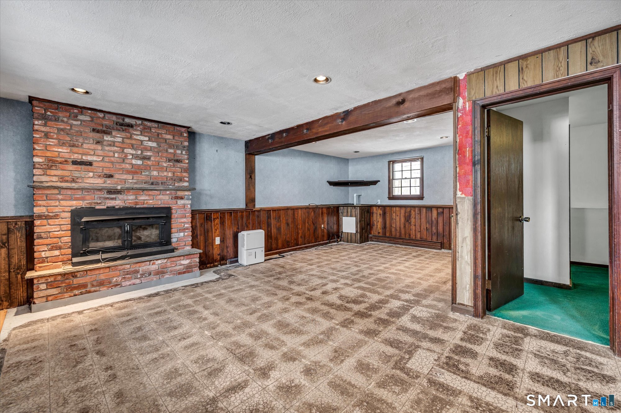 147 Tuttle Road Durham, CT 06422 - Photo 25 of 38 a view of empty room with a fireplace and window