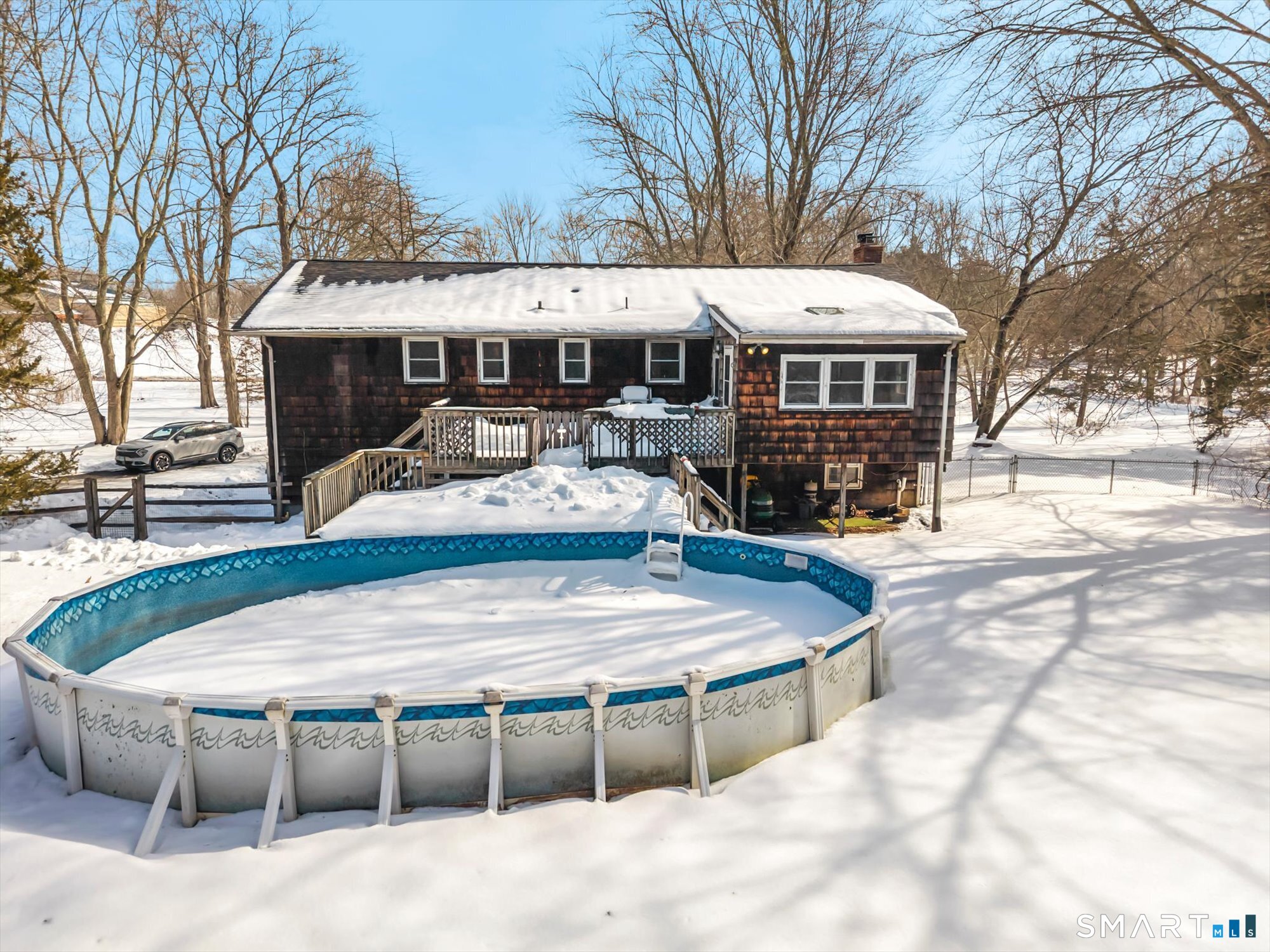 147 Tuttle Road Durham, CT 06422 - Photo 28 of 38 a wooden bench sitting in front of a building