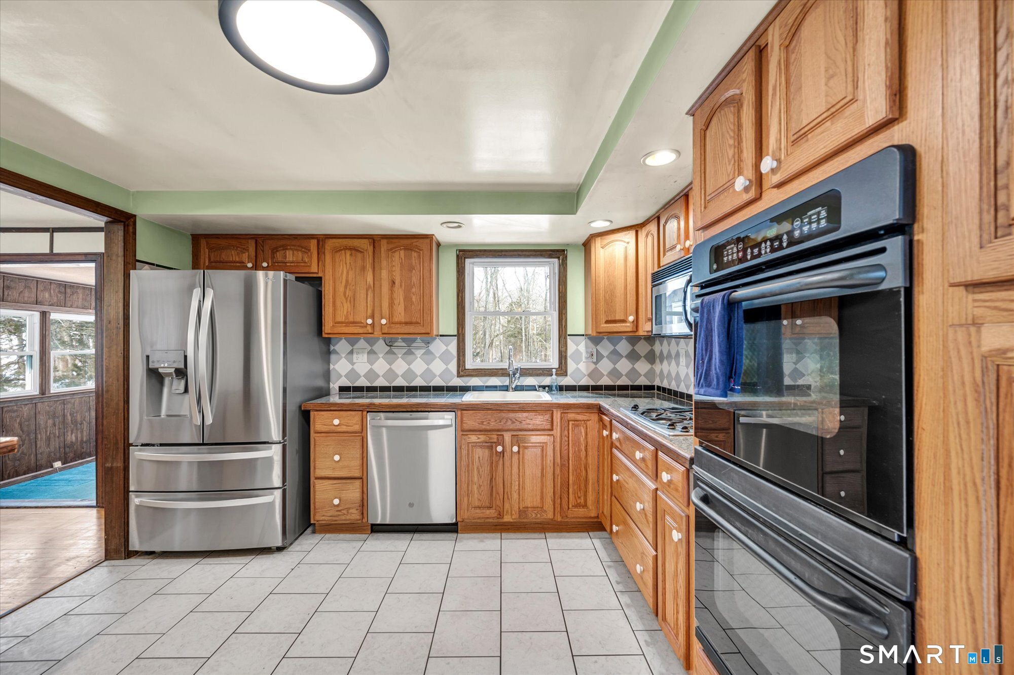 147 Tuttle Road Durham, CT 06422 - Photo 33 of 38 a kitchen with granite countertop stainless steel appliances a sink and cabinets