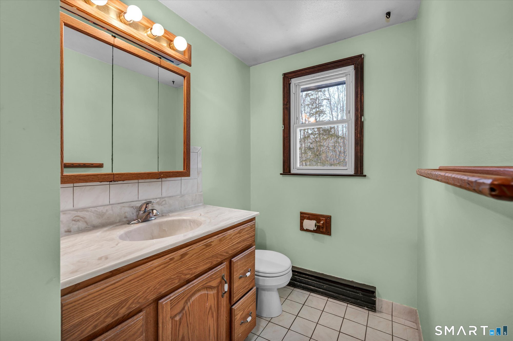 147 Tuttle Road Durham, CT 06422 - Photo 34 of 38 a bathroom with a granite countertop toilet a sink and a mirror