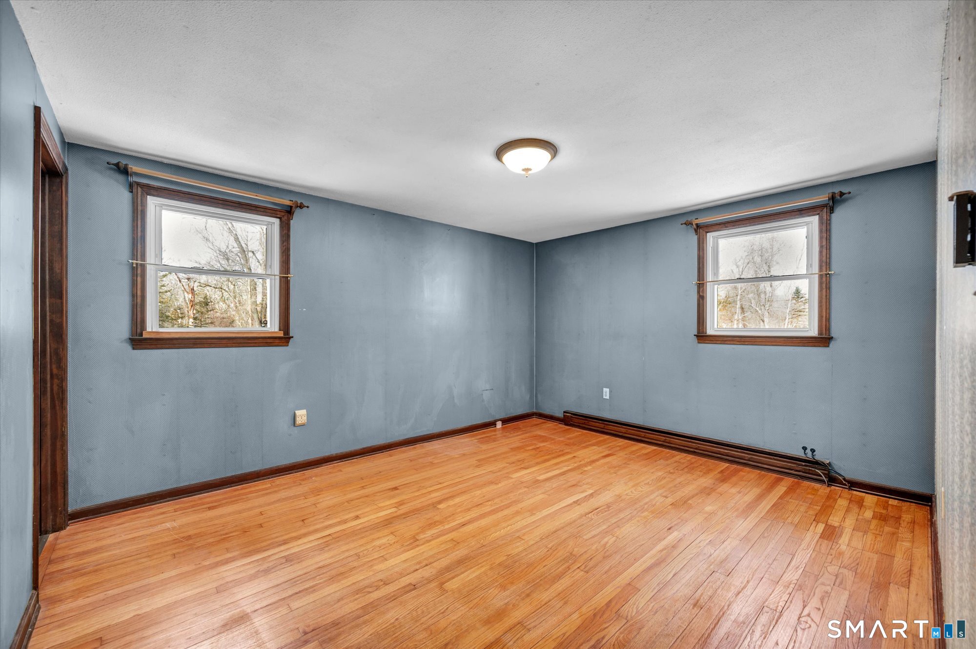 147 Tuttle Road Durham, CT 06422 - Photo 36 of 38 a view of an empty room with wooden floor and a window