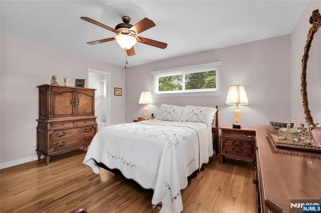 23 Ridge Court Cedar Grove, NJ 07009 - Photo 21 of 37 a bedroom with a bed and wooden floor