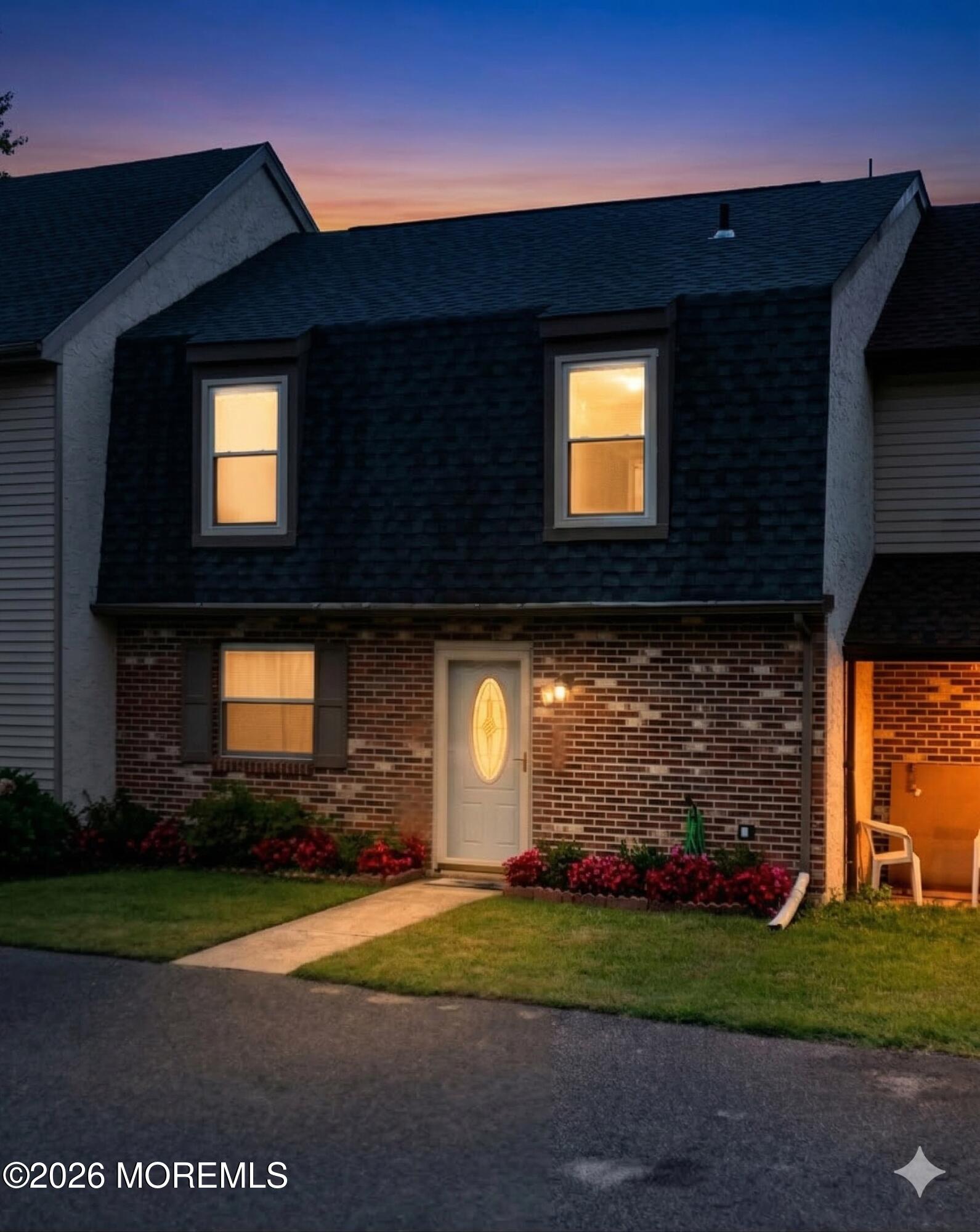 a front view of a house with a yard
