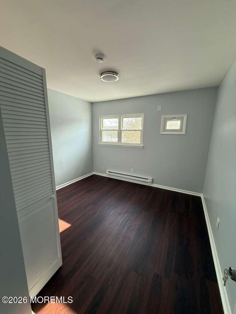 38 Noble Road Sicklerville, NJ 08081 - Photo 5 of 6 an empty room with wooden floor and windows
