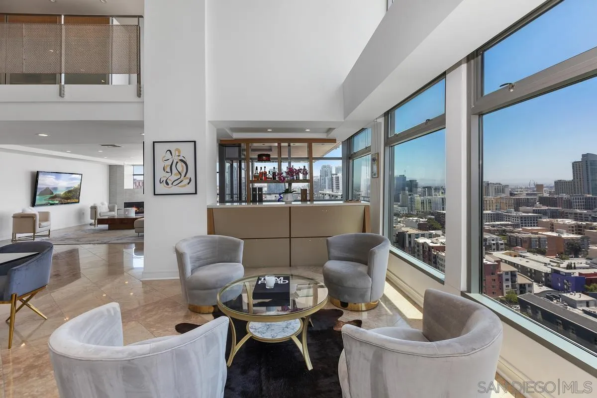 645 Front Street, Unit 2004 San Diego, CA 92101 - Photo 13 of 47 a living room with furniture and a floor to ceiling window