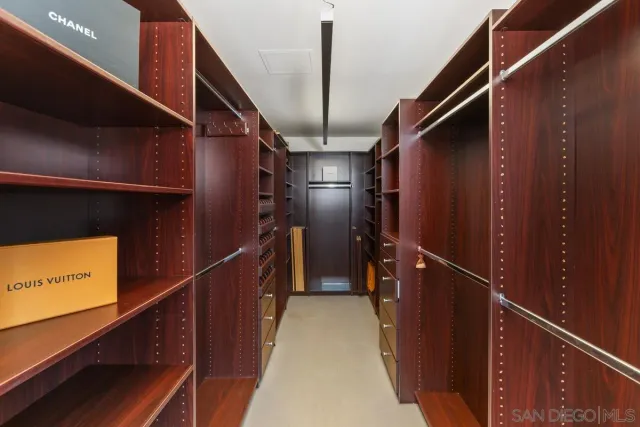 a view of an empty room with empty shelves