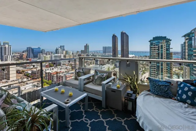 a view of living room with furniture and clutter