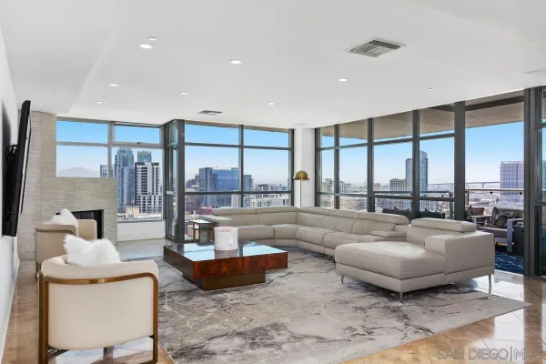 a living room with furniture and a large window
