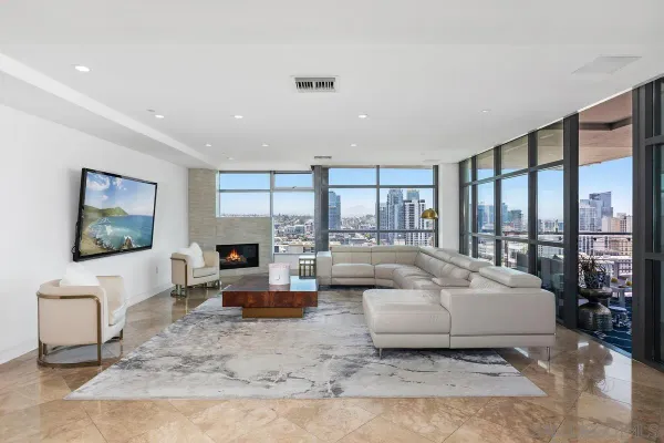 a living room with fireplace furniture and a flat screen tv