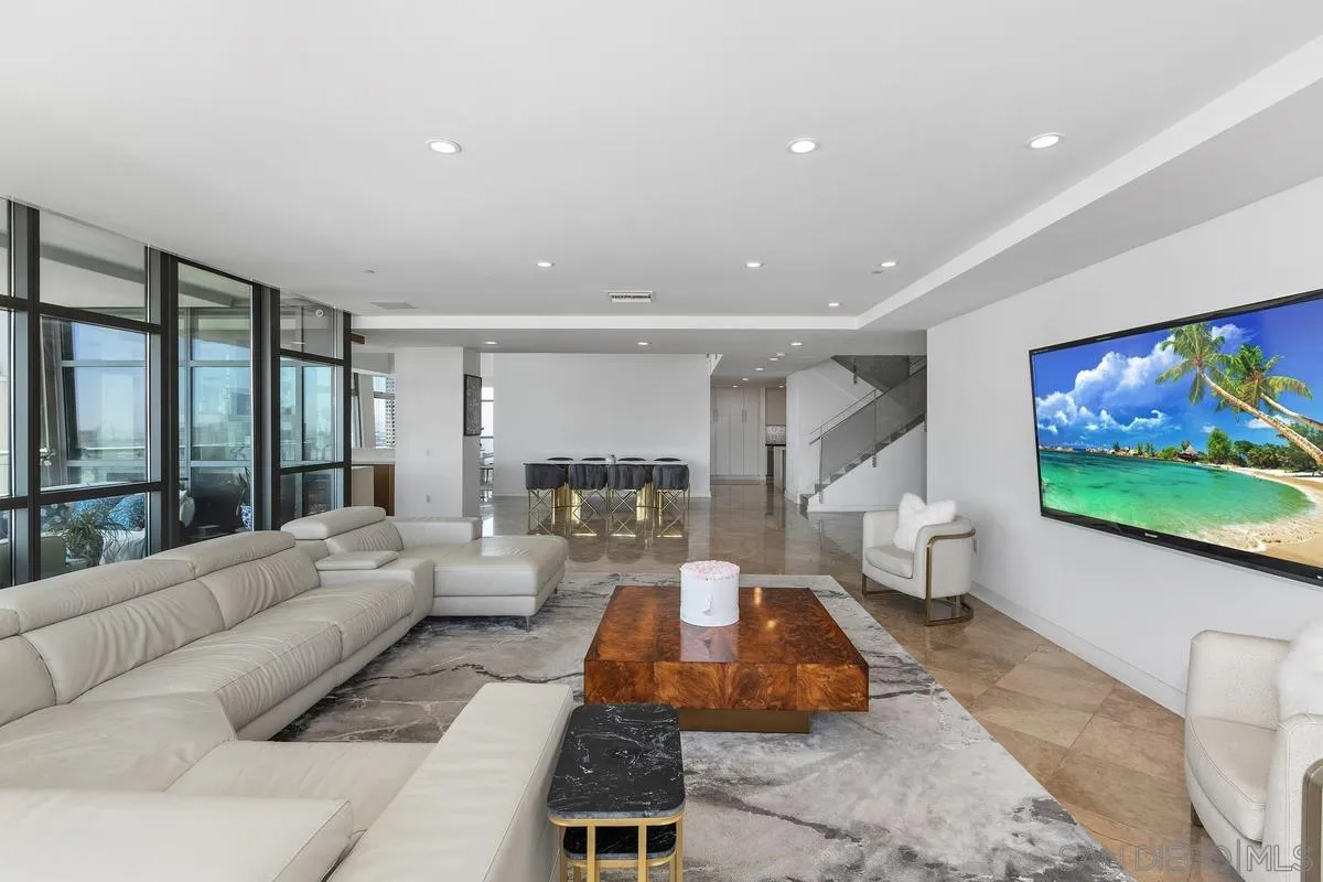 645 Front Street, Unit 2004 San Diego, CA 92101 - Photo 8 of 47 a living room with furniture and a flat screen tv