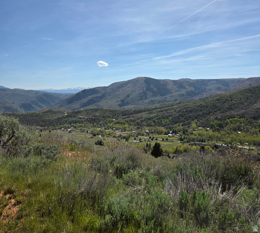 3325 North Oak Cyn Road, Unit 490 Huntsville, UT 84317 - Photo 3 of 25 Expansive mountain landscape featuring rolling hills and distant snow-capped peaks