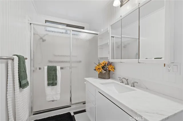 a bathroom with a sink and mirror