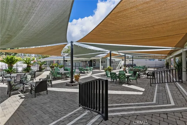 a view of a patio with chairs and tables