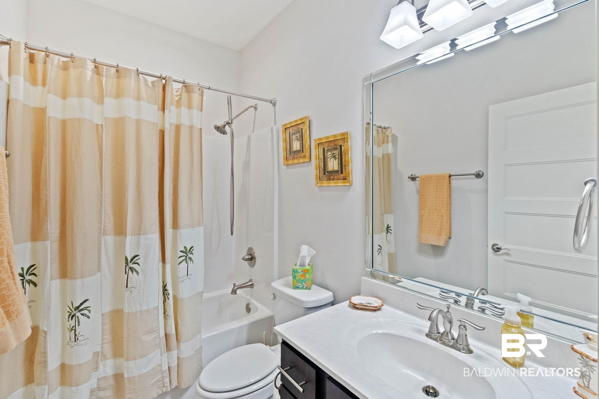 192 Mark Twain Loop Foley, AL 36535 - Photo 29 of 42 Full bathroom featuring vanity, shower / bathtub combination with curtain, and toilet