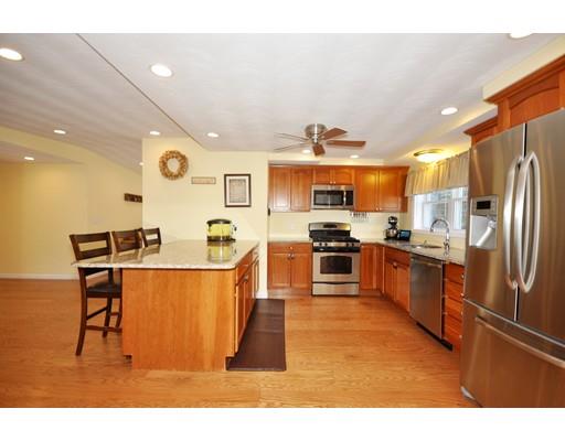 16 Judith Road Chelmsford, MA 01824 - Photo 2 of 14 a kitchen with stainless steel appliances kitchen island granite countertop a sink and cabinets