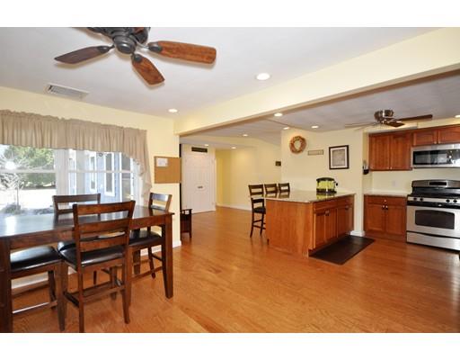 16 Judith Road Chelmsford, MA 01824 - Photo 3 of 14 a open kitchen with stainless steel appliances kitchen island granite countertop a table and chairs