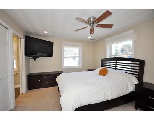 16 Judith Road Chelmsford, MA 01824 - Photo 10 of 14 a bedroom with a bed and a flat screen tv