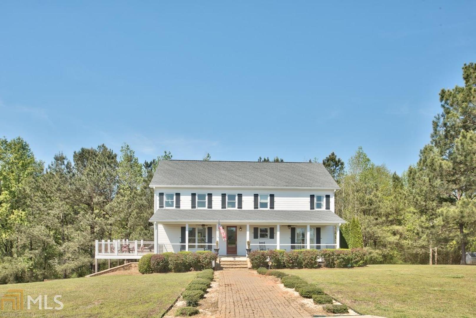 4591 Spears Road Madison, GA 30650 - Photo 1 of 1 a front view of a house with a yard