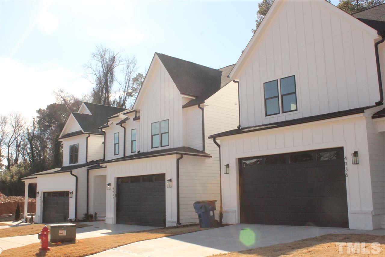 a front view of a house with garage