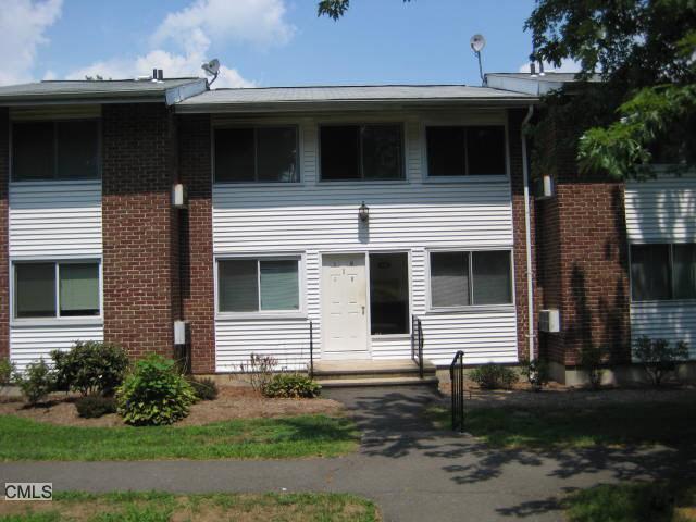 80 County Street, Unit 1M Norwalk, CT 06851 - Photo 1 of 1 a front view of a house with a yard