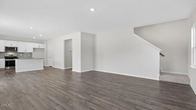 a view of kitchen with wooden floor and windows