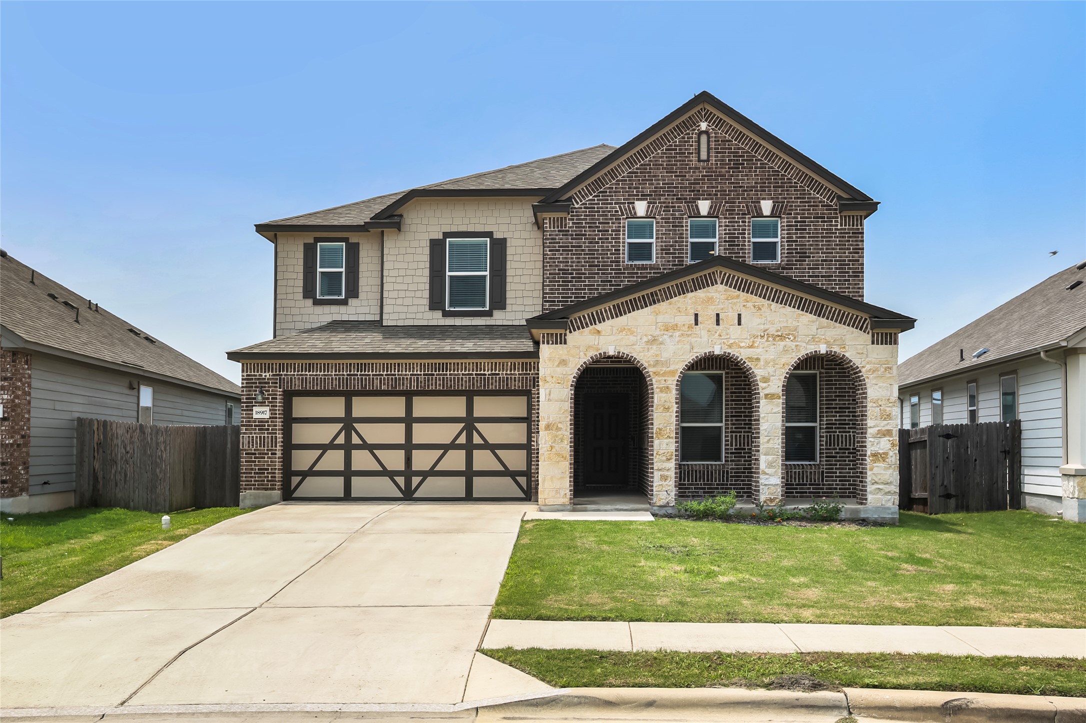 18917 Rushmore Street Manor, TX 78653 - Photo 25 of 28 a front view of a house with a garden