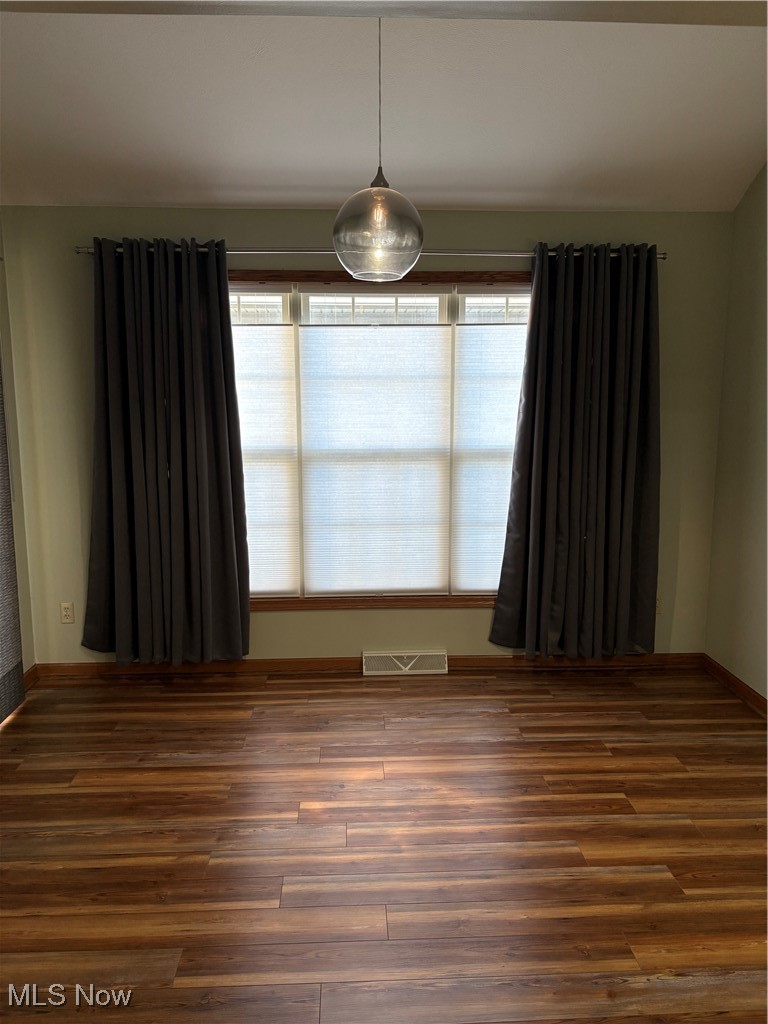 6695 Clingan Road, Unit 24 Youngstown, OH 44514 - Photo 8 of 26 Unfurnished room featuring wood finished floors