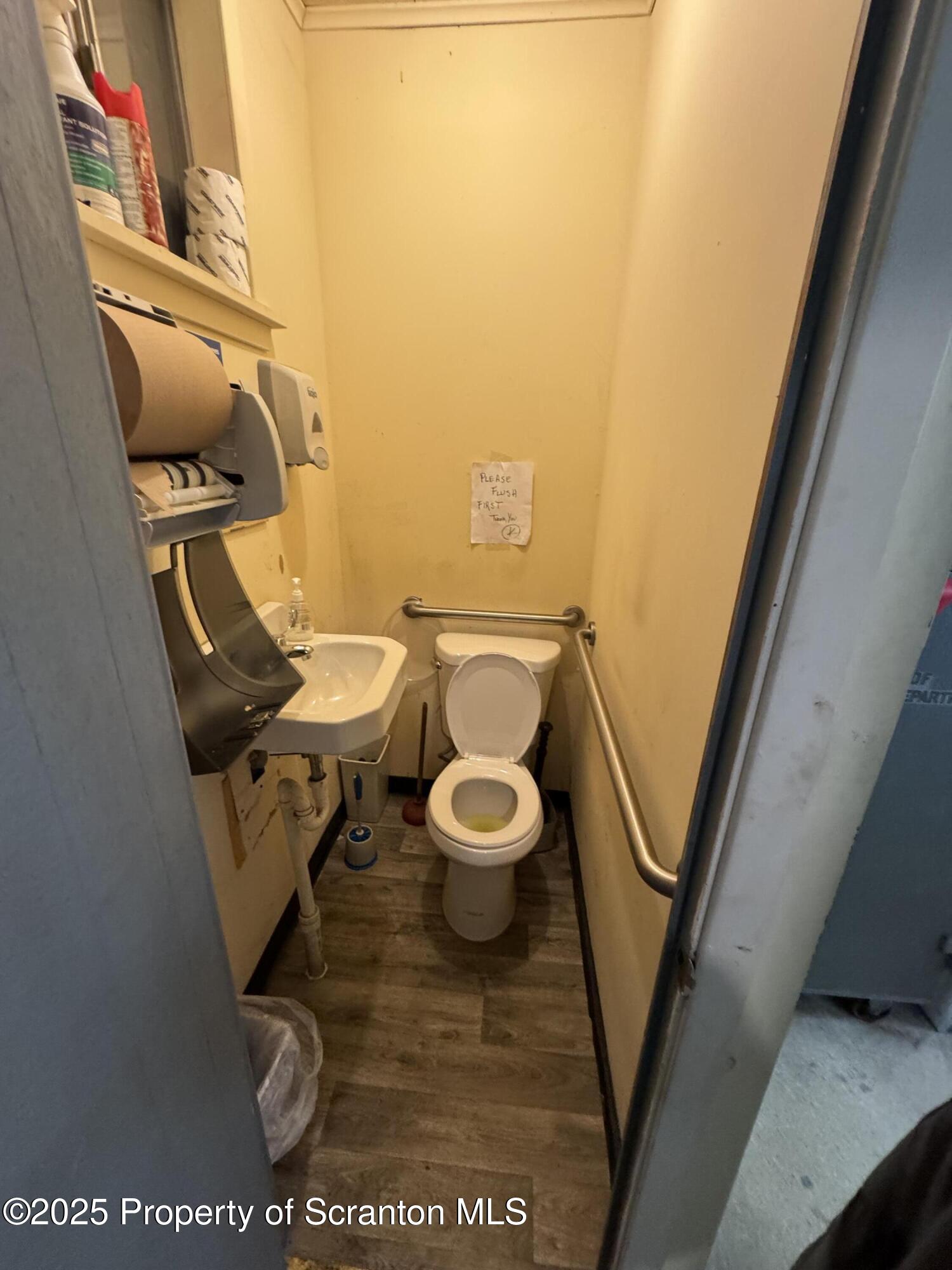 3061-3065 Main Street Clarks Summit, PA 18411 - Photo 13 of 34 a bathroom with a toilet and a sink