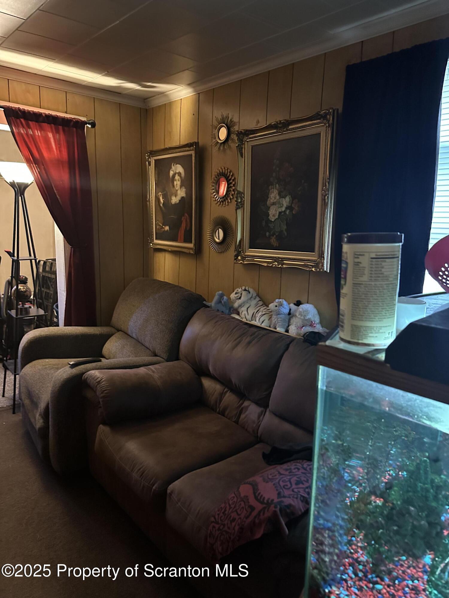3061-3065 Main Street Clarks Summit, PA 18411 - Photo 16 of 34 a living room with furniture and a floor to ceiling window