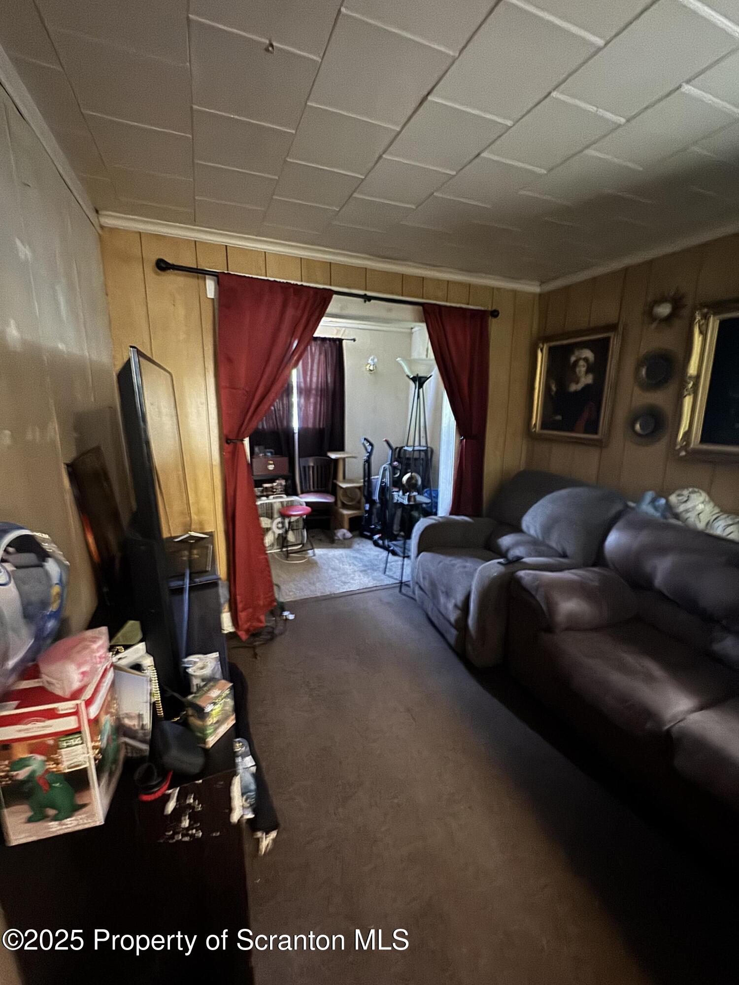 3061-3065 Main Street Clarks Summit, PA 18411 - Photo 17 of 34 a living room with furniture a window and gym equipment