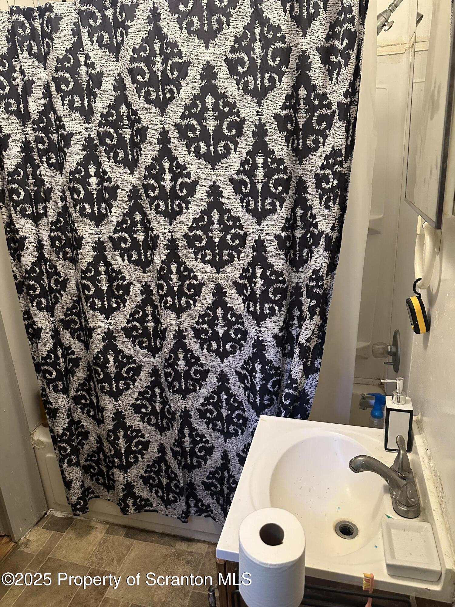 3061-3065 Main Street Clarks Summit, PA 18411 - Photo 18 of 34 a bathroom with a bathtub and sink