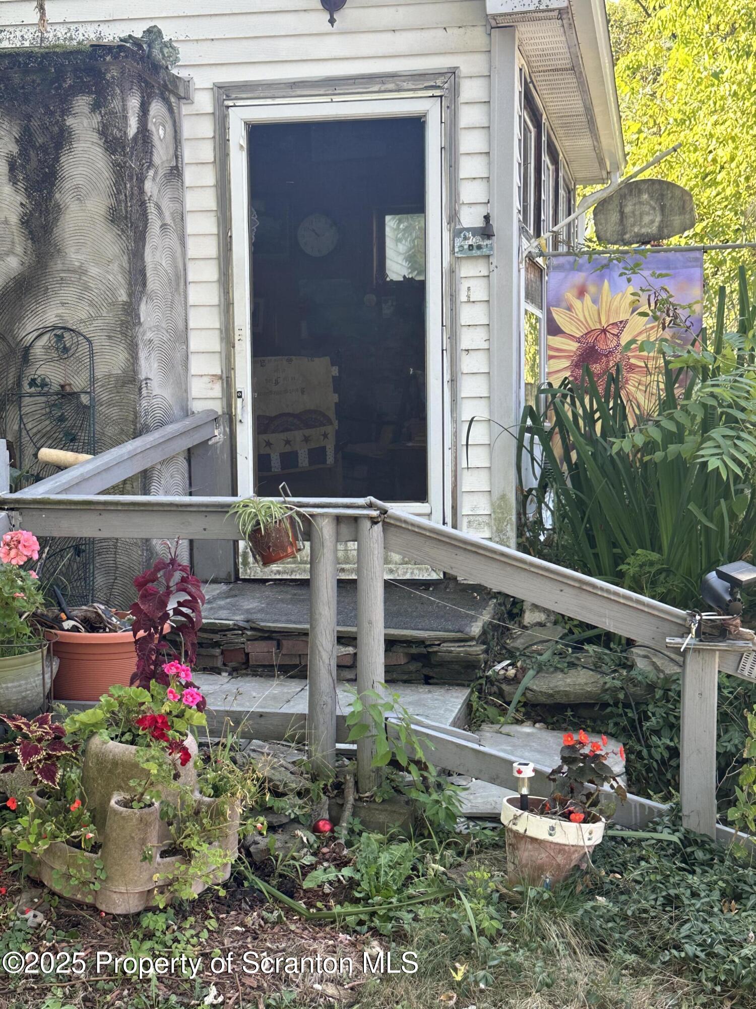 3061-3065 Main Street Clarks Summit, PA 18411 - Photo 22 of 34 a side view of a house